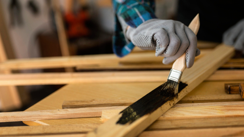 https://hillcrestpaintingandflooringservices.com.au/wp-content/uploads/2025/06/female-workshop-painting-wood.jpg